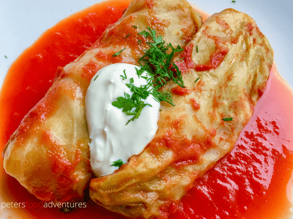 Dutch Oven Cabbage Rolls, made with layers of bacon. Known as Golubtsi, a family dinner favorite the whole family loves. Delicious, economical and can feed an army of people. What's not to love about this dish! Stovetop Cabbage Rolls (Голубцы)