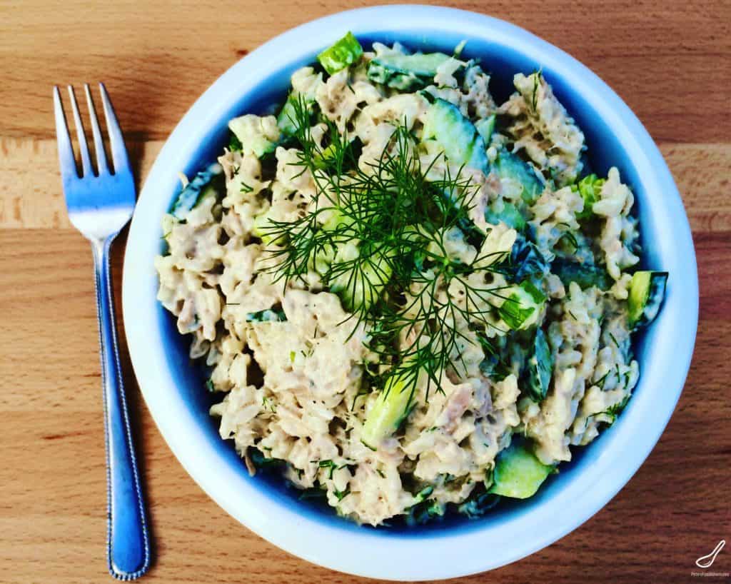 Russian salads aren't leafy, they're hearty! This creamy Tuna Rice Salad recipe is perfect for your summer bbq or picnic. Tuna, rice, cucumbers, green onions, dill and lots of of mayo!