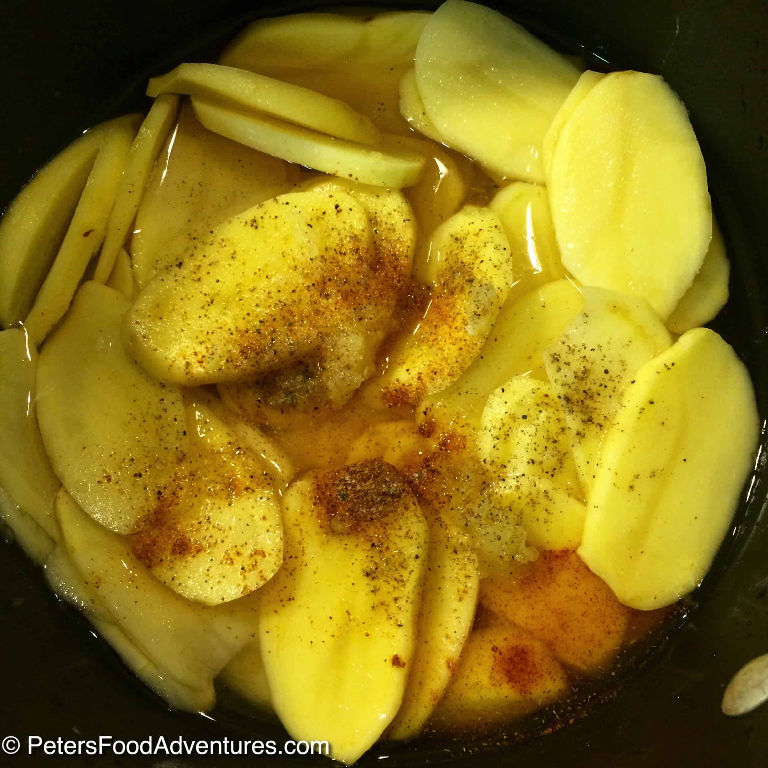 sliced potatoes in a pot with spice
