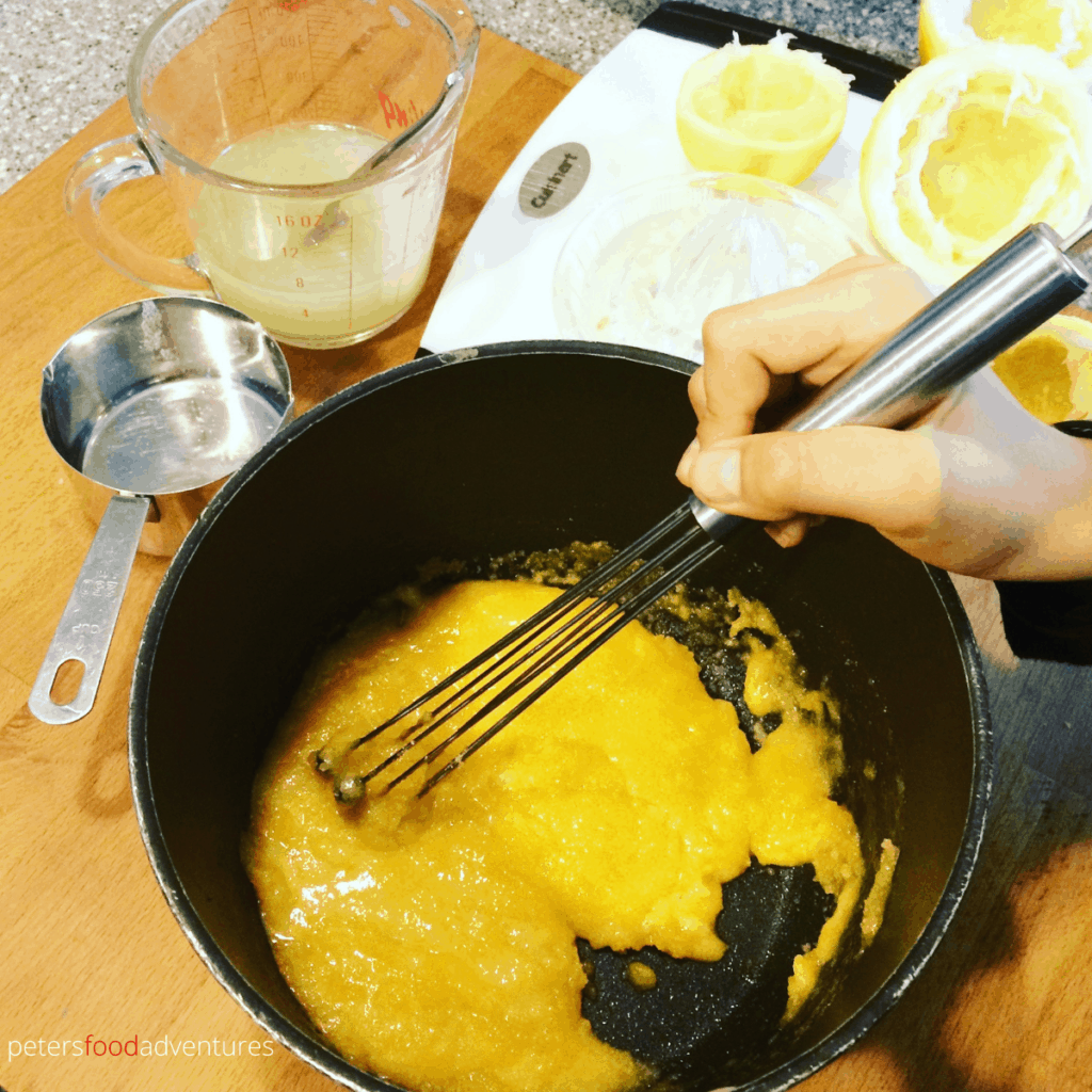 whisking lemon curd in a pot