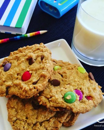 The Best Monster Cookies recipe you'll try. Everything you want in a cookie like oats, smarties, chocolate chips, peanut butter! This large batch recipe makes enough to feed a small army!