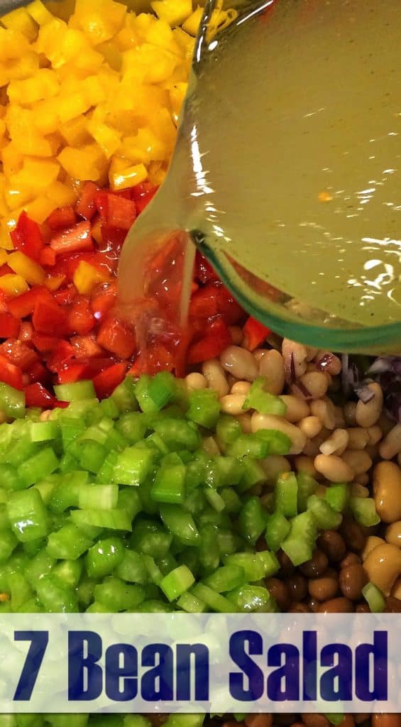 dressing pouring into bean salad