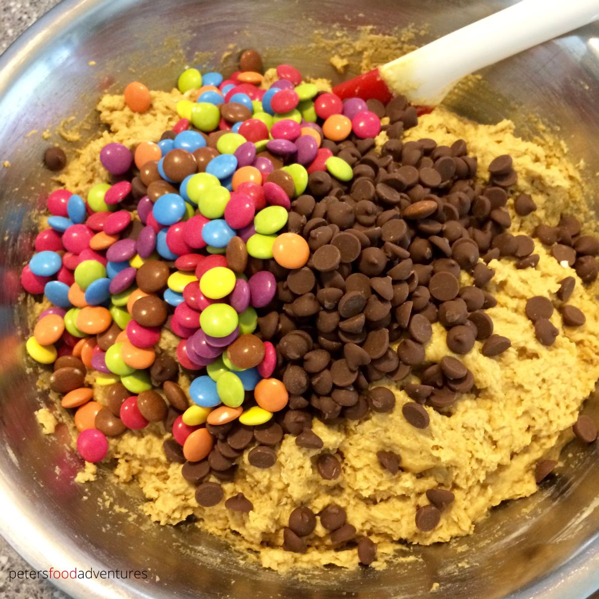 mixing cookie dough with smarties