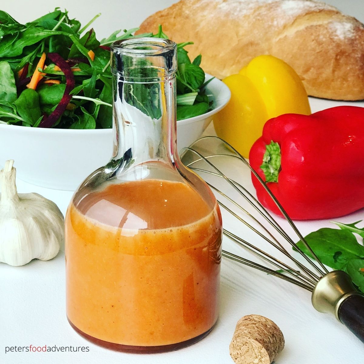french dressing in a bottle beside a salad