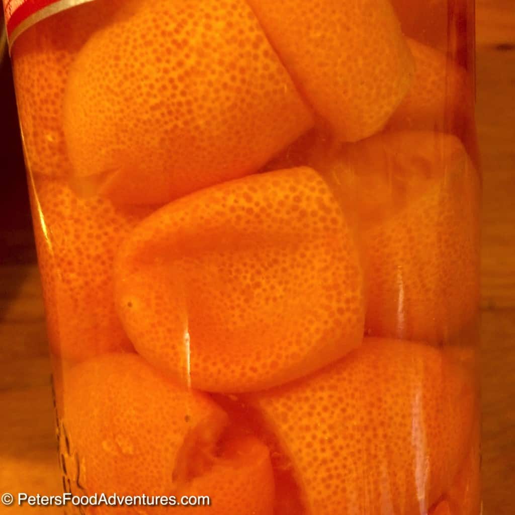 kumquats infusing in vodka to make liqueur