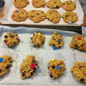 Everything You Want in a Cookie! Oats, Smarties, Chocolate Chips, Peanut Butter! A classic American cookie! This large batch recipe makes enough to feed a small army! Easy Monster Cookies Recipe