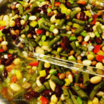 An Easy 7 Bean Salad recipe perfect for large potlucks, church events, bbq's or summertime gatherings. Looks and tastes amazing!