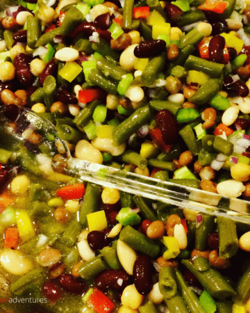 An Easy 7 Bean Salad recipe perfect for large potlucks, church events, bbq's or summertime gatherings. Looks and tastes amazing!