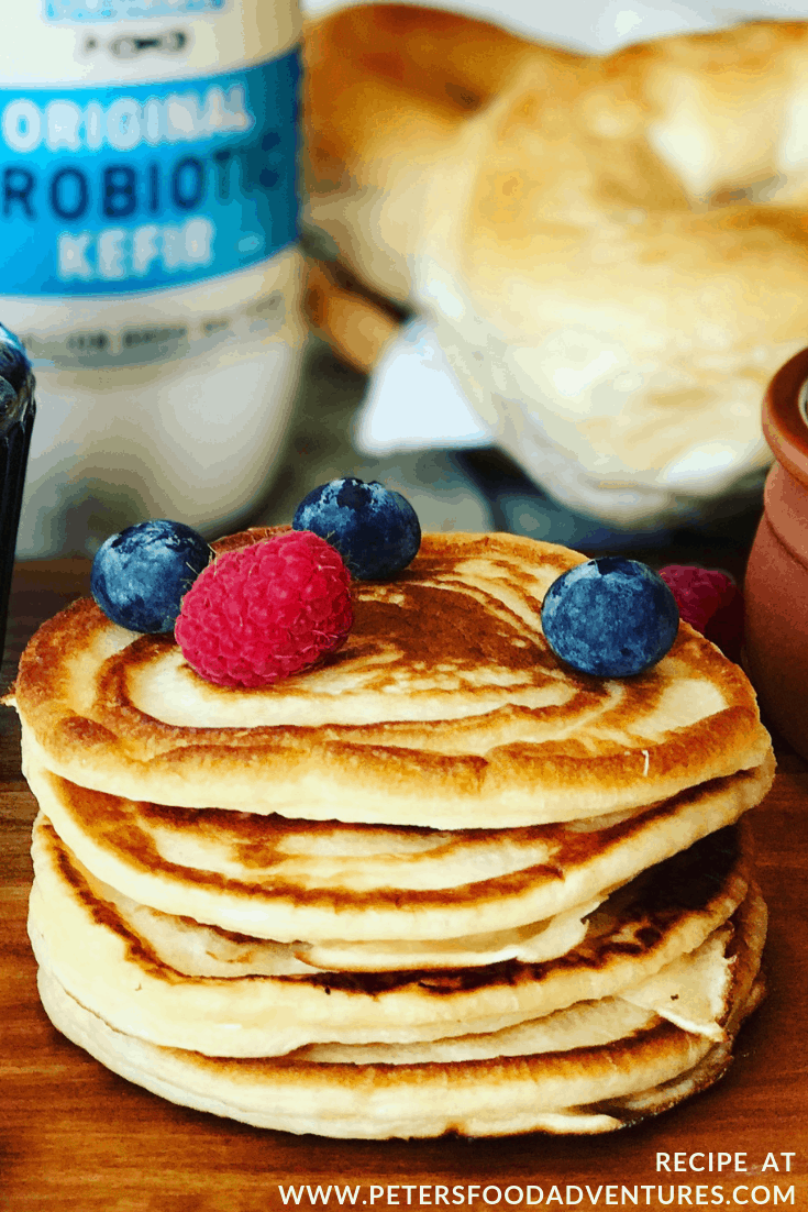 stack of pancakes with kefir and berries