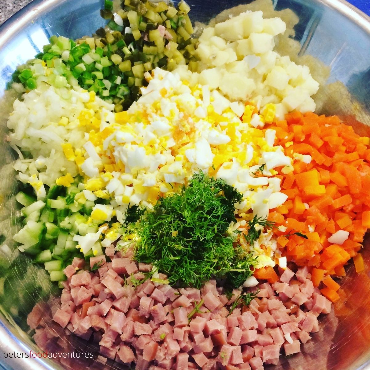 chopped Olivier Salad ingredients in a bowl