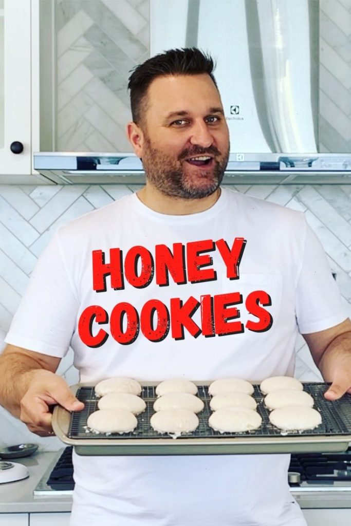 man holding tray of cookies