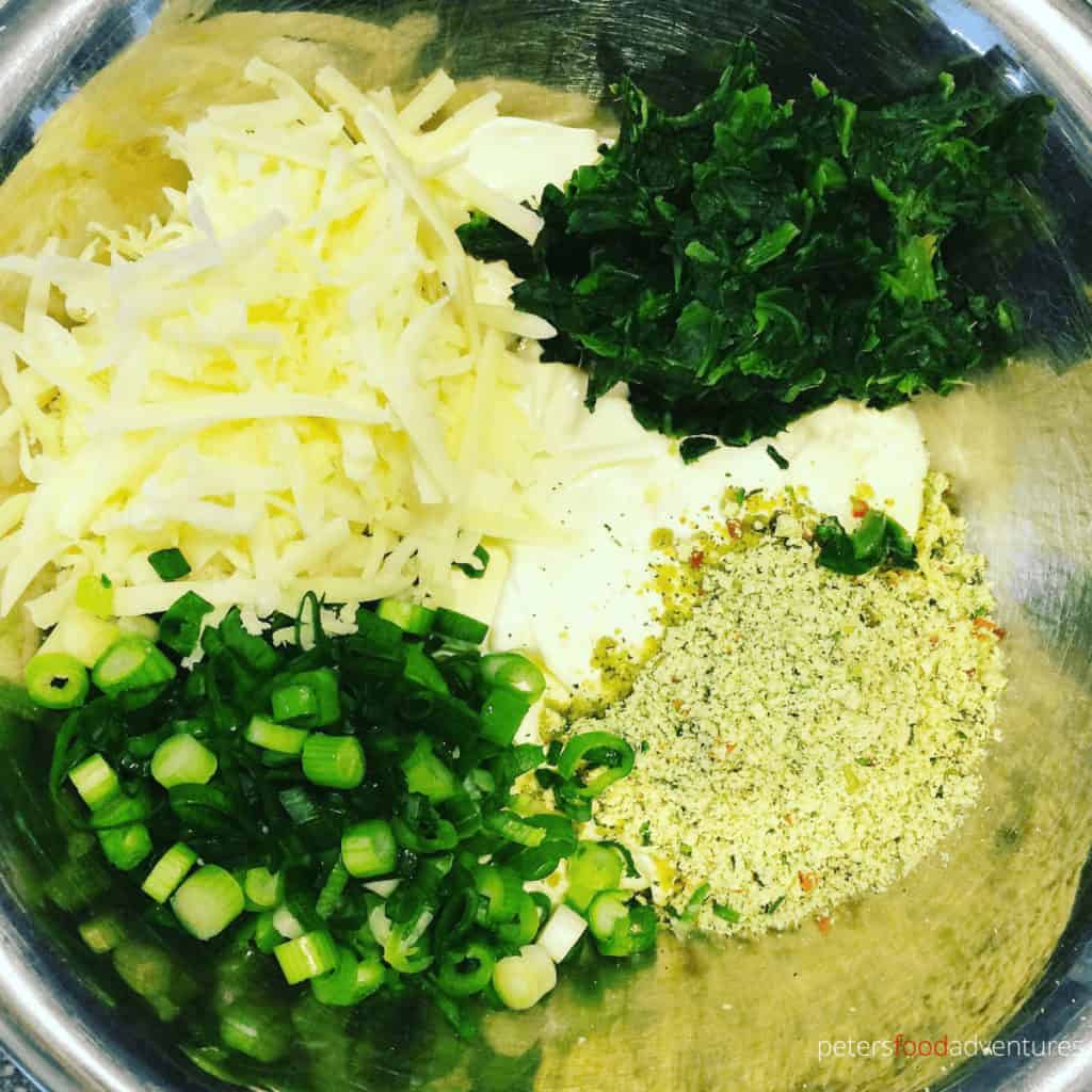 mixing spinach dip ingredients in a bowl
