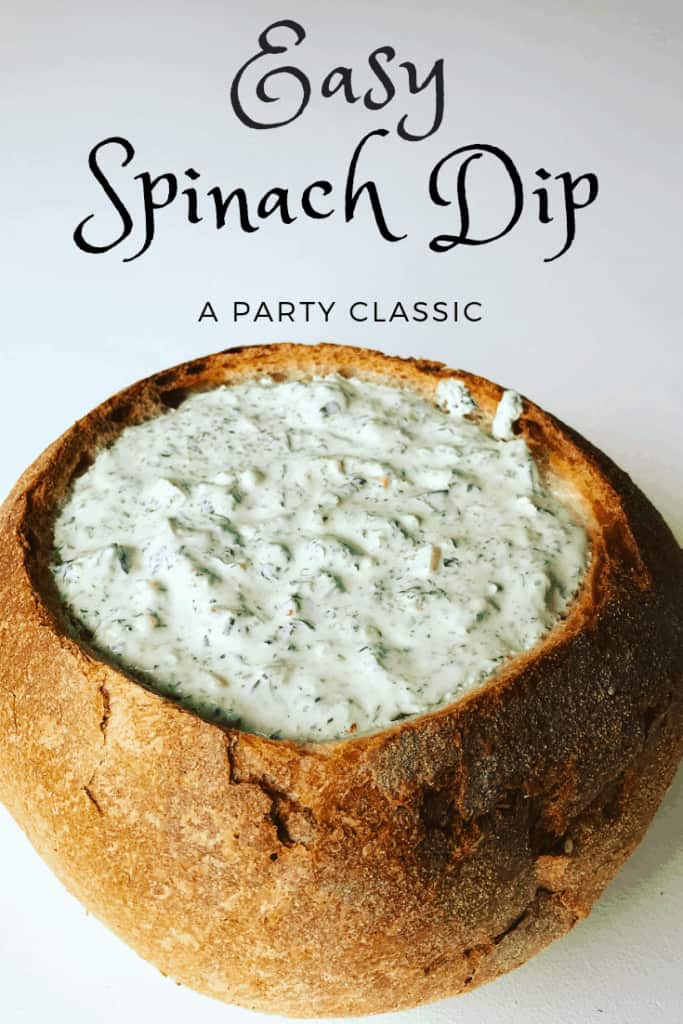 Spinach Dip in a Bread Bowl on a white background
