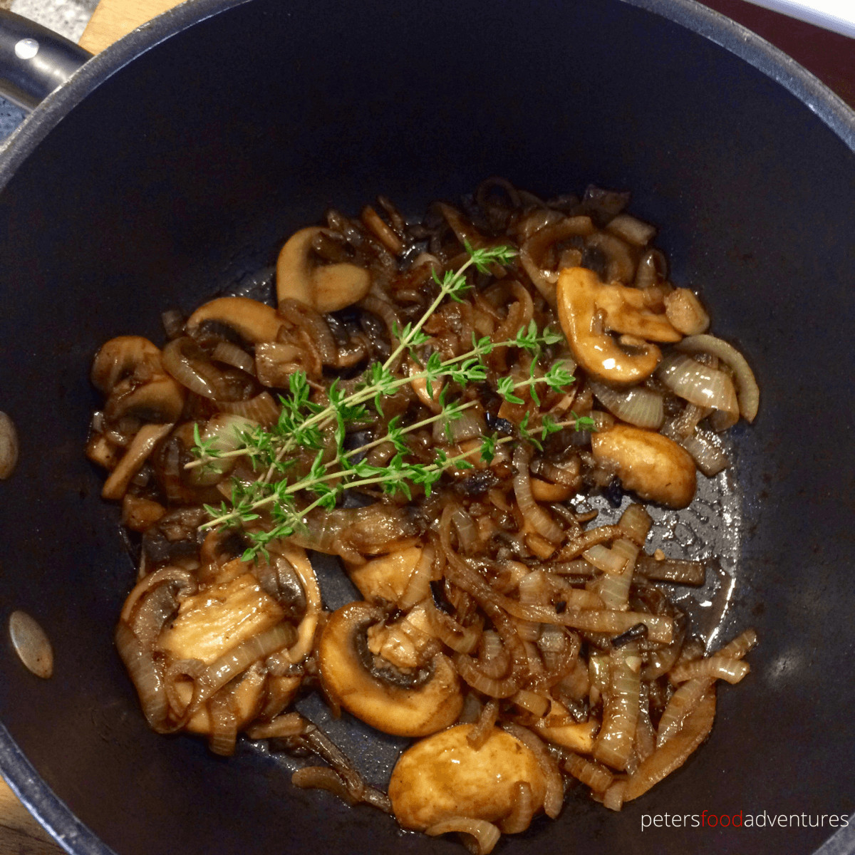Saute mushrooms au jus with fresh thyme