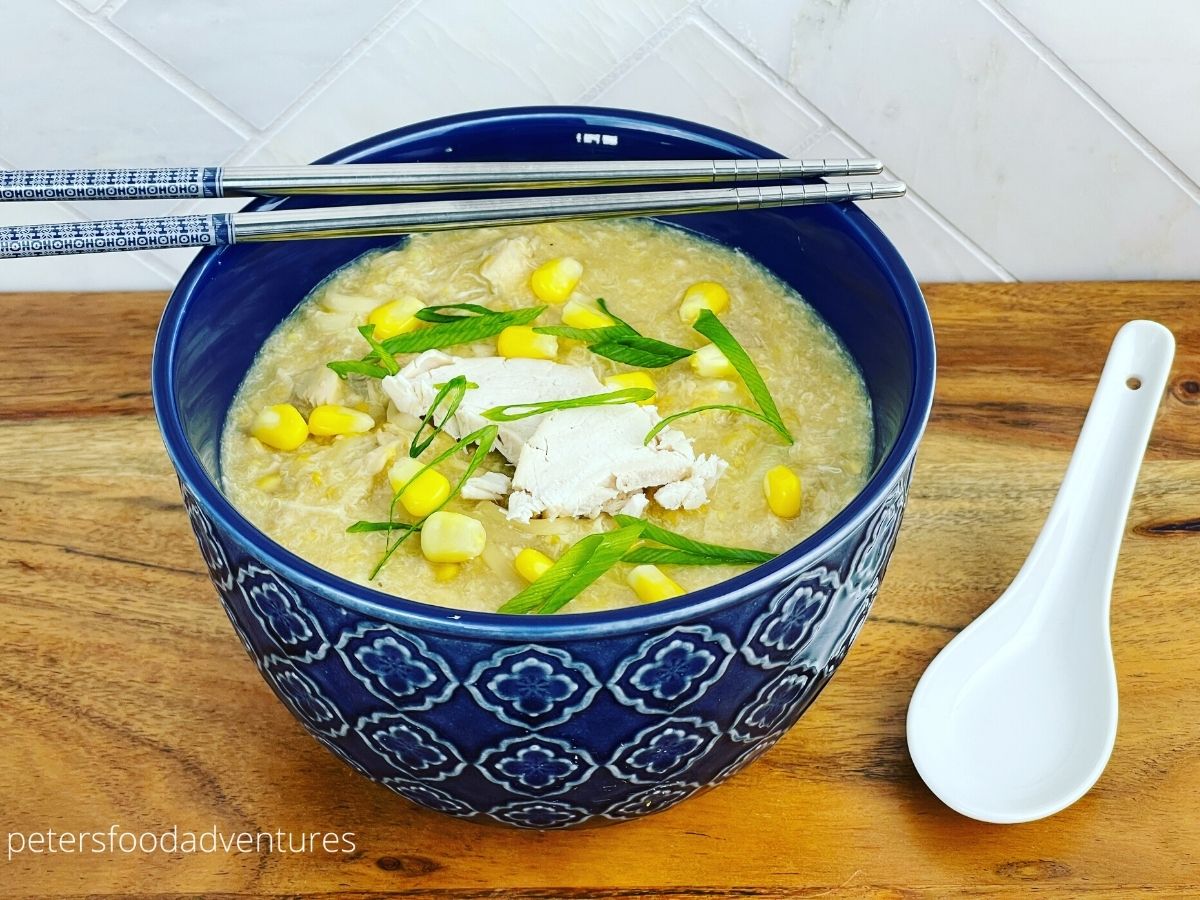 bowl of Chinese chicken corn soup with chopsticks