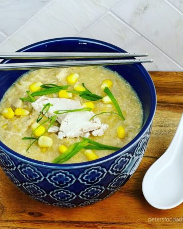 bowl of Chinese chicken corn soup with chopsticks