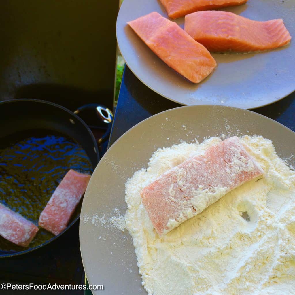 dusting salmon in flour before frying