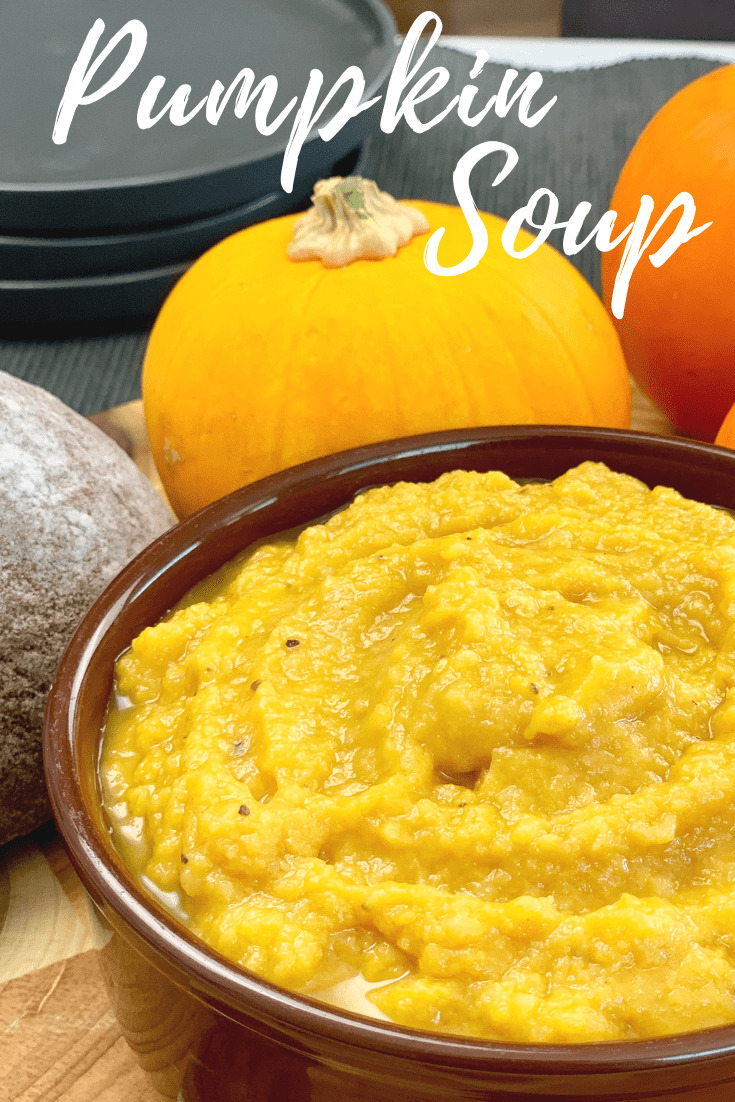pumpkin soup in bowl with baby pumpkins