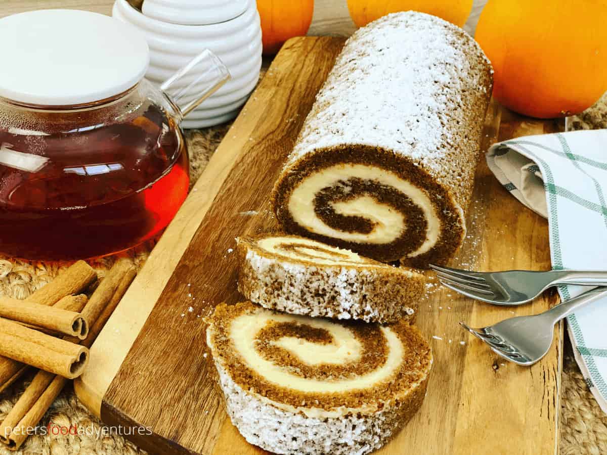 Pumpkin Roll is the perfect holiday treat for Thanksgiving or Christmas! A moist pumpkin Swiss Roll, made with pumpkin pie spice and covered in sweet cream cheese. A perfect holiday treat.