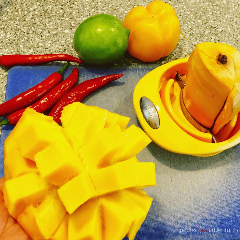 cutting mangoes with a mango slicer