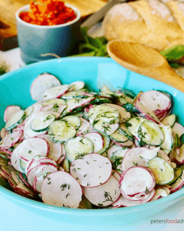 Russian Radish Salad is a simple and rustic salad. Tossed in a creamy sour cream dressing with fresh dill. A delicious addition to your summer salad rotation. Creamy, crunchy, radish and cucumber salad is healthy and full of flavor