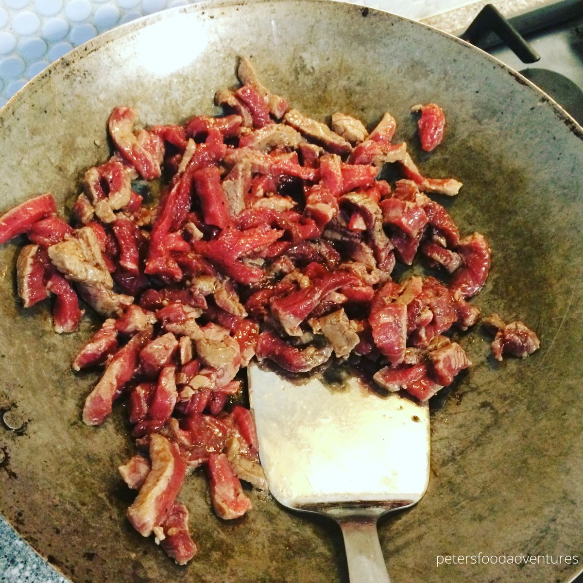 stir fried beef in wok