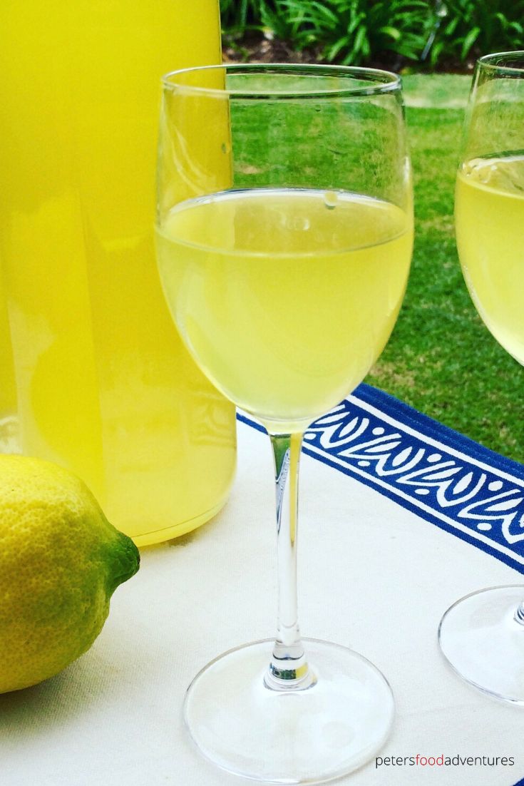 2 glasses of limoncello outside on a table