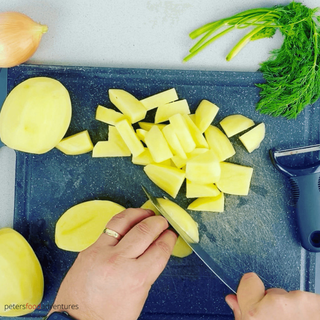 chopping potatoes on a cutting board