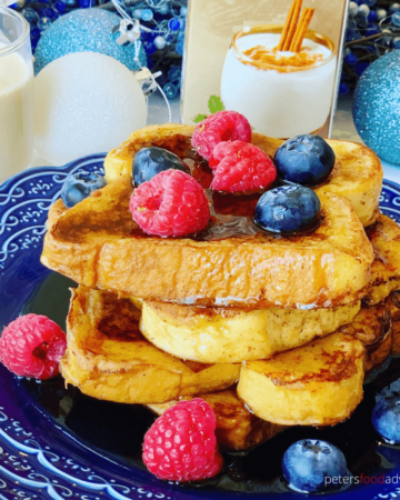 Eggnog French Toast is the perfect Christmas morning breakfast treat. Delicious and easy to make. Made with cinnamon and nutmeg, served with maple syrup and whipped cream.