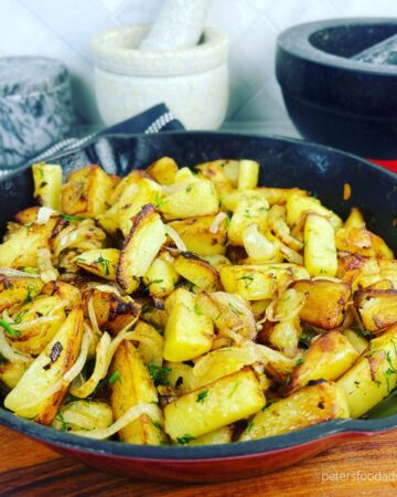 fried potatoes and onions in skillet
