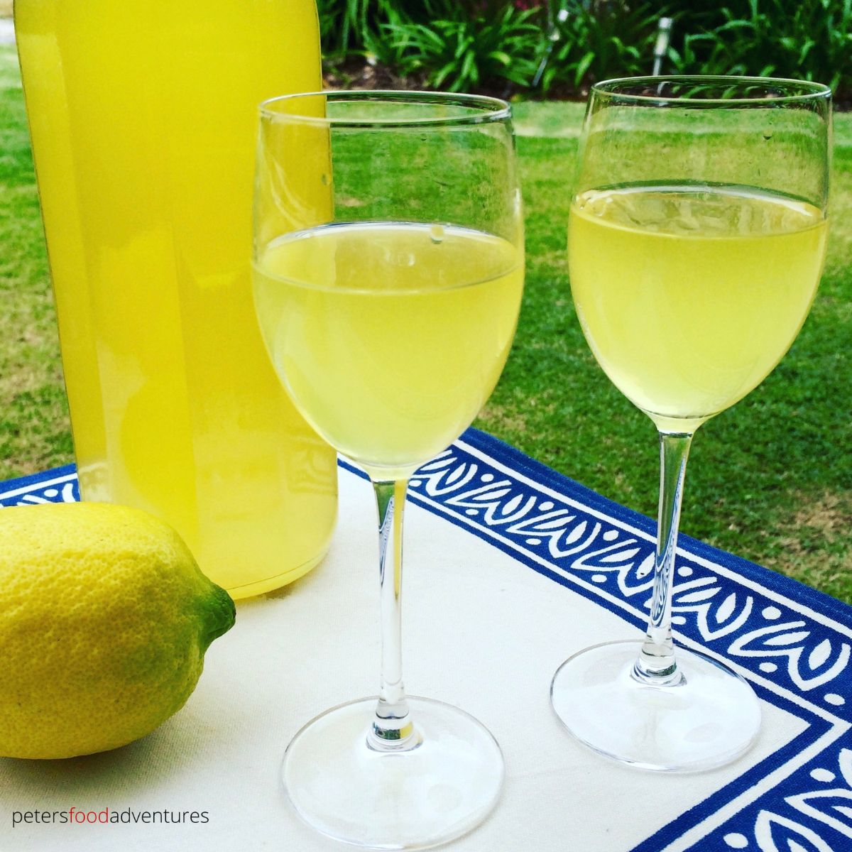 2 glasses of limoncello outside on a table