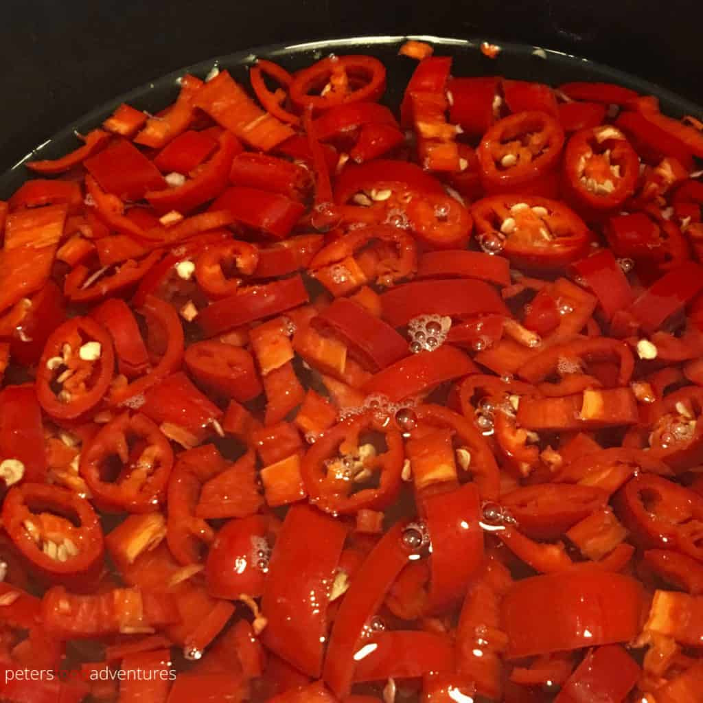 making thai chili sauce with spicy peppers