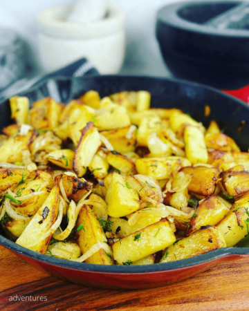 Russian Pan Fried Potatoes with onions are an easy dinner side dish, or for breakfast! A classic comfort food in any culture. Crispy Skillet Potatoes are sure to be a family favorite! (Жареная картошка с луком)