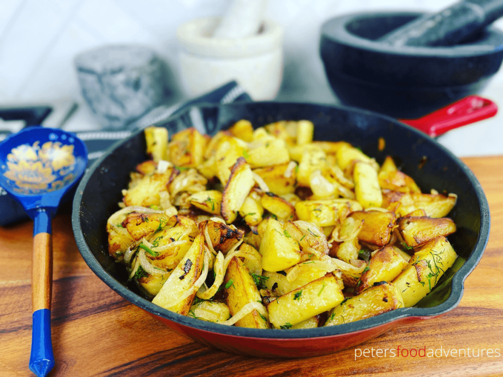 Russian Pan Fried Potatoes with onions are an easy dinner side dish, or for breakfast! A classic comfort food in any culture. Crispy Skillet Potatoes are sure to be a family favorite! (Жареная картошка с луком)