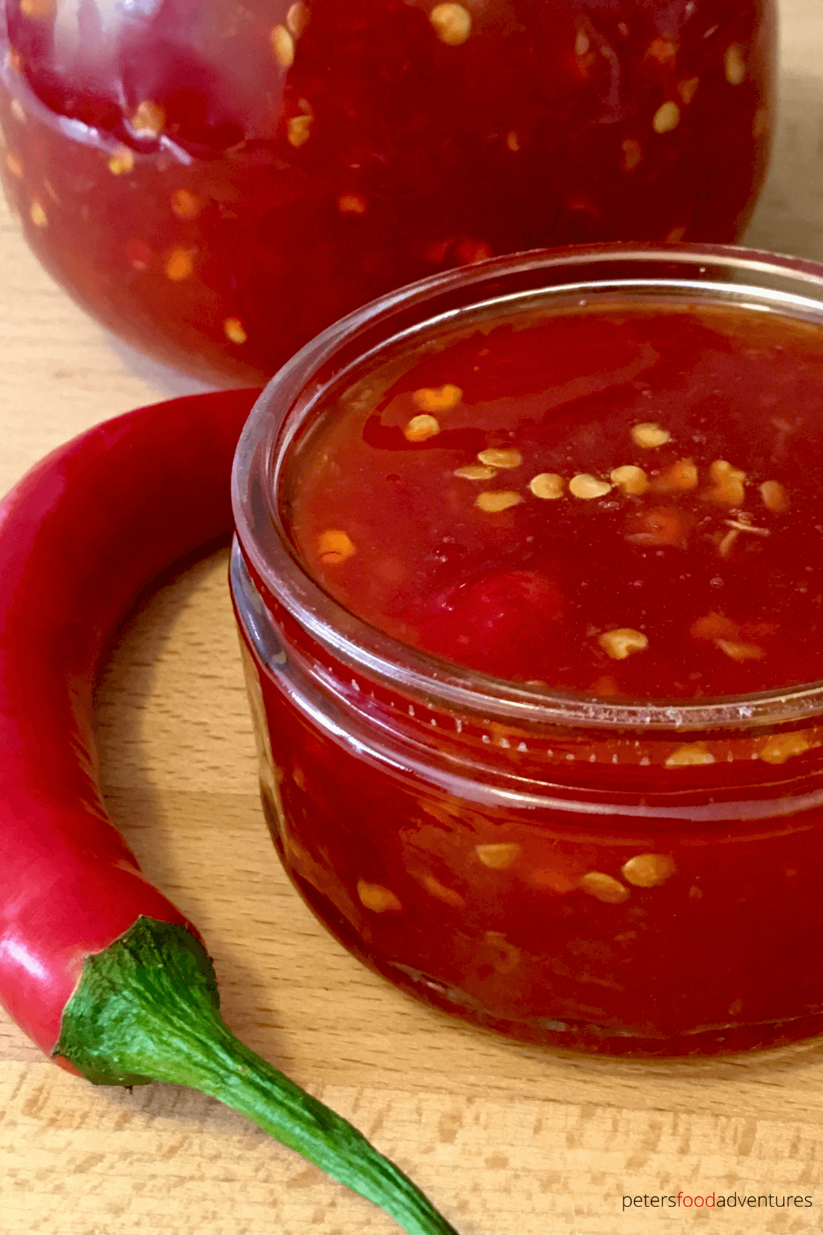 This Homemade Thai Sweet Chili Sauce has so much flavor with red chilis, garlic and ginger. An exotic sauce that's sweet and spicy, a perfect dipping sauce, marinade and flavor booster! Known as name chim (น้ำจิ้มไก่) which means "dipping sauce for chicken".