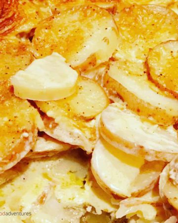 A tasty sidedish that's full of flavor! Creamy Scalloped Potatoes has Parmesan Cheese, whipping cream, garlic, mustard powder, nutmeg and butter. Easy to make, everyone will love this potato bake recipe!
