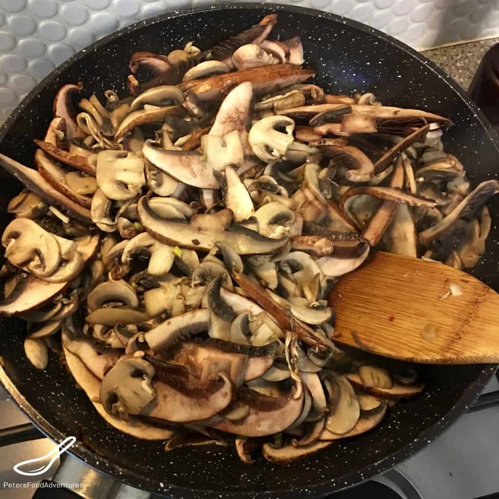 Frying mushrooms in a pan for mushroom soup