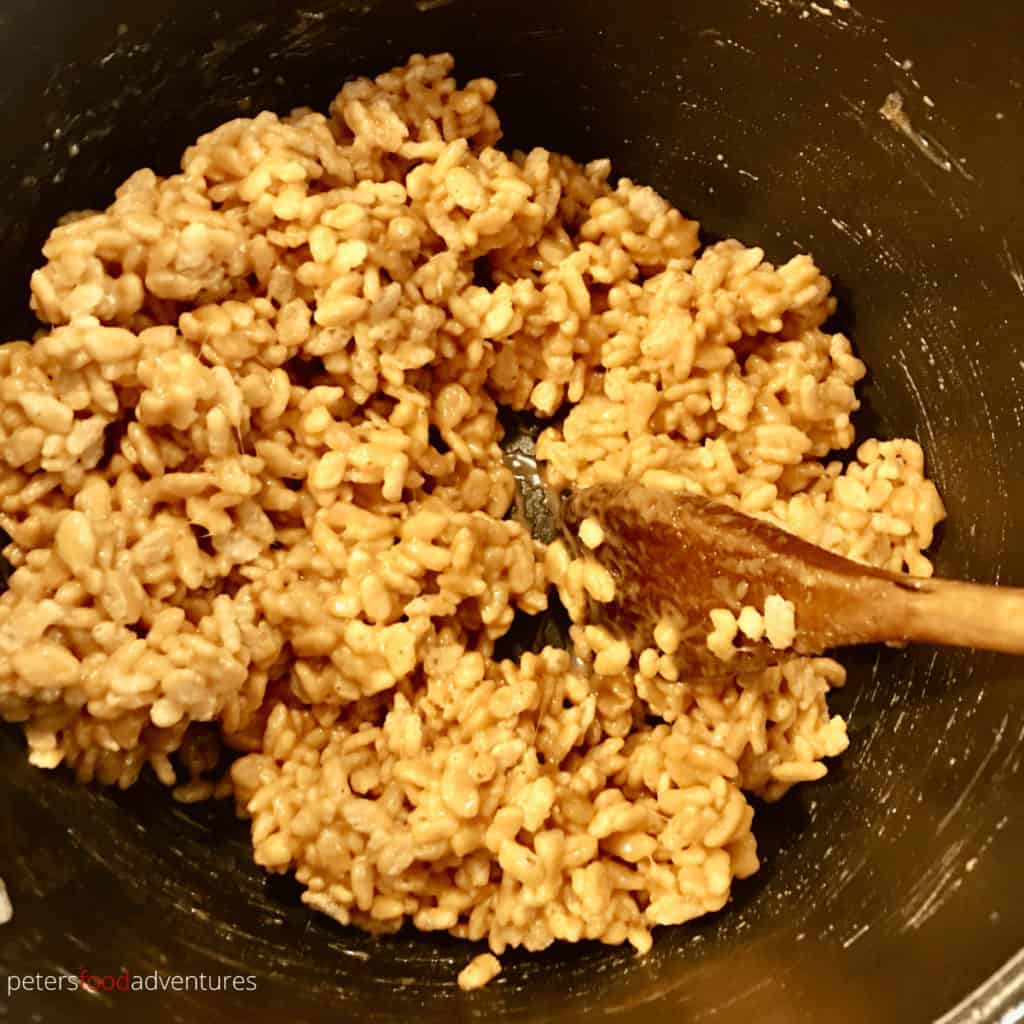 mixing caramel rice krispies