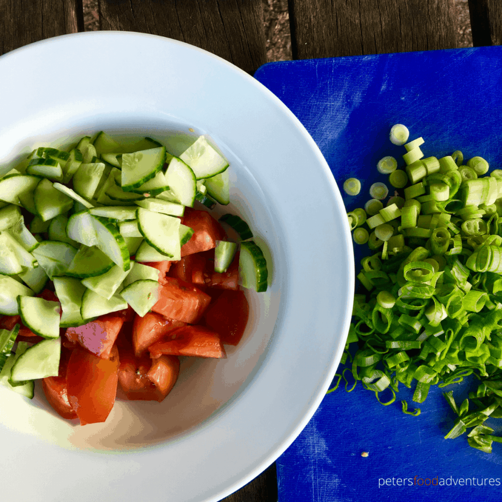 preparing tomato cucumber salad