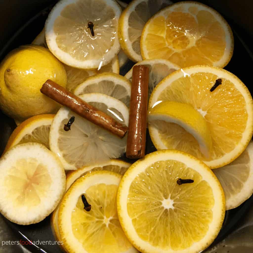 citrus spiced tea with sliced lemons and oranges