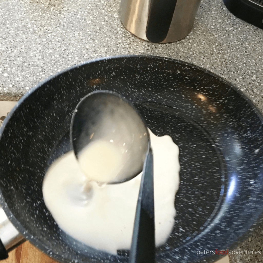 pouring blini into pan