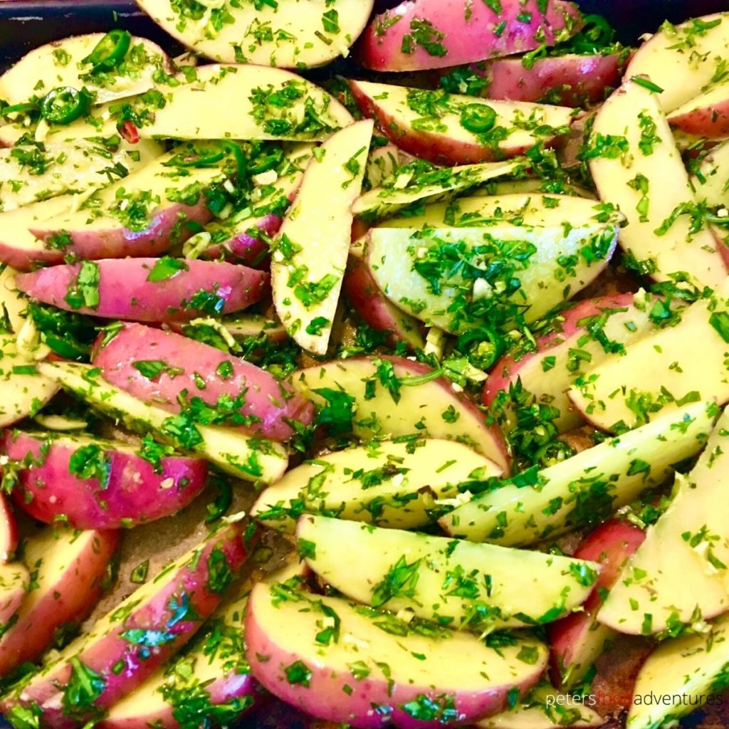 potato wedges covered in herbs