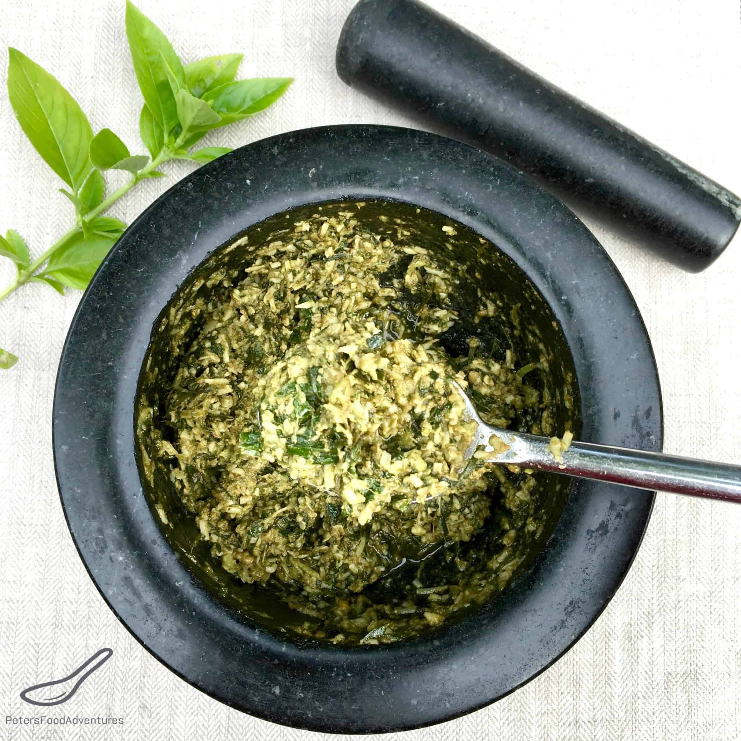 Homemade Pesto in a Mortar and Pestle with fresh basil
