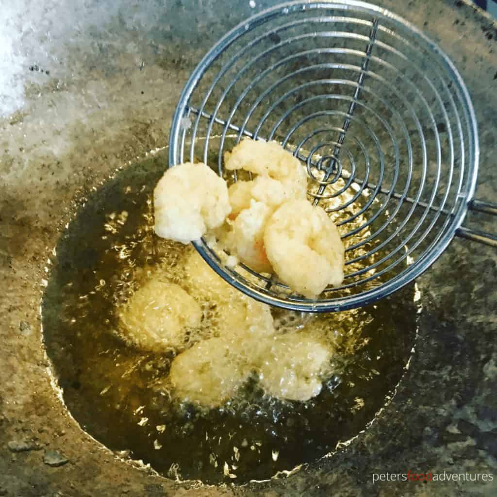 frying shrimp in a wok