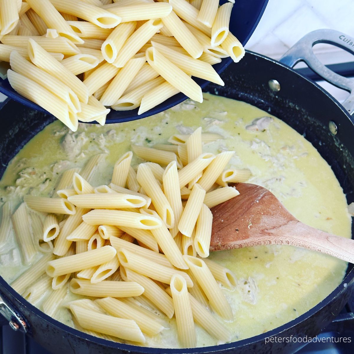 adding penne to pan
