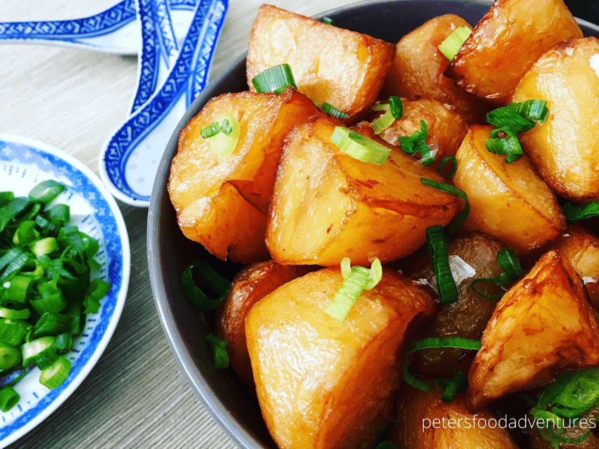 asian potatoes in a bowl with green onions