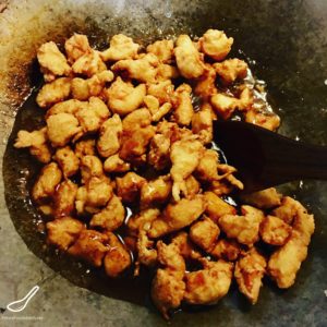 Coating Chicken in Honey Sesame Sauce