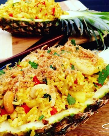 Authentic Thai Pineapple Fried Rice served inside a pineapple! Easy to make and delicious!