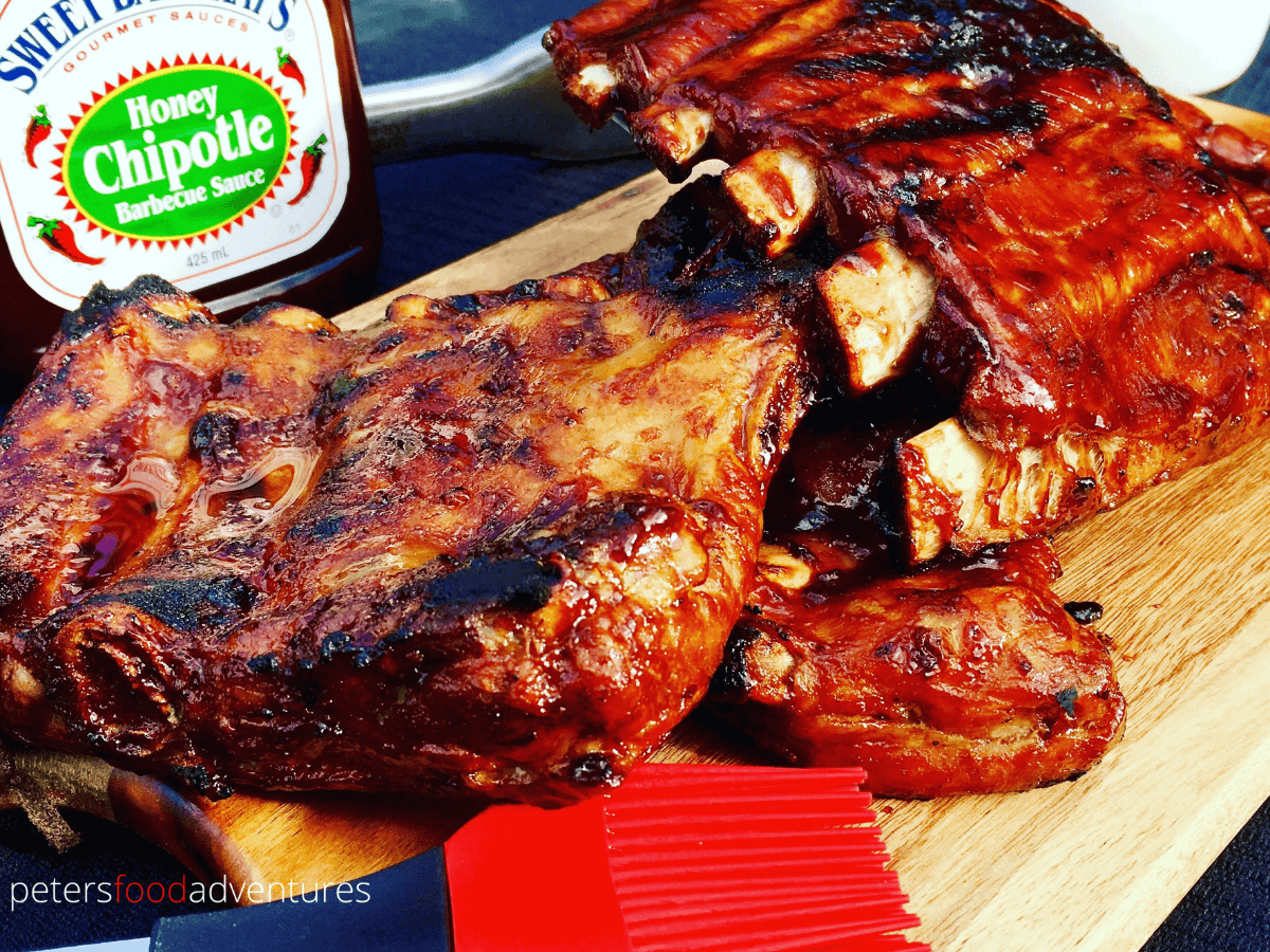 Tender BBQ Ribs, brine boiled ribs in stock broth with coriander seeds, then generously smothered in Bbq Sauce before grilling. Saves time, adds flavor to ribs that fall off the bone! Fast Bbq Pork Ribs Recipe