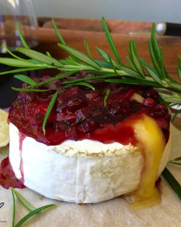 Baked Brie with Cranberry or Lingonberry Sauce (брусника). I love this classic holiday appetizer. Quick and easy to make, sweet and savory combined with melted gooey cheese.